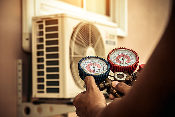 Professional Heat Pump Repair technician working in Montgomery, TX